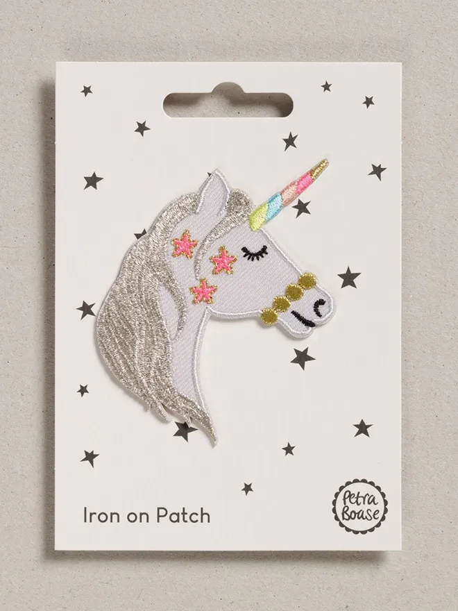 Unicorn head iron on embroidered fabric patch. 