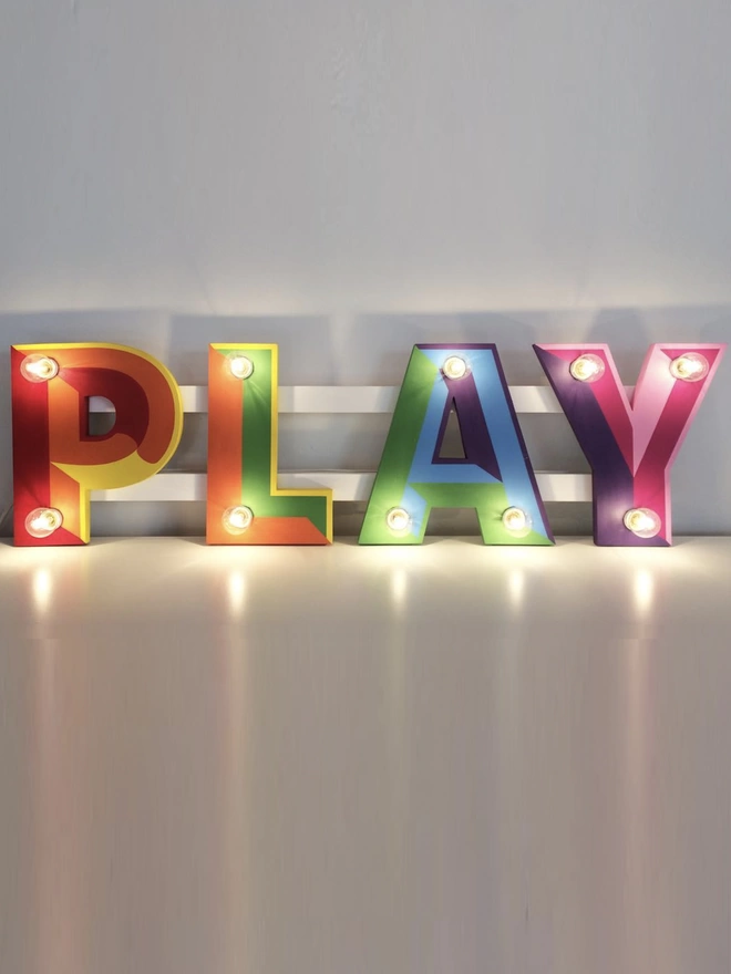 Play sign with lights