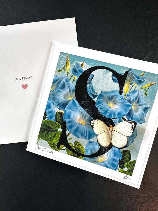 The personalised September birthday card with personalisation, showing a hand signed name and personalised, printed envelope. The butterfly wings are folded outwards, creating a pretty, three dimensional effect when displayed.