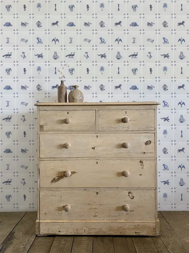 delft tile illustrated wallpaper. a white background wallpaper with blue tile-style illustrated squares.