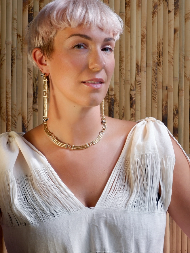 gold vermeil Bamboo bar drop earrings with black & white gemstone beads, model photo with matching Gold vermeil bamboo bar sectional necklace