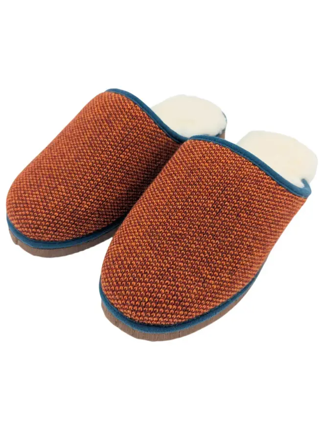 Women's Lambswool & Sheepskin Slippers, a pair of colourful slippers sitting on a white plain surface. 