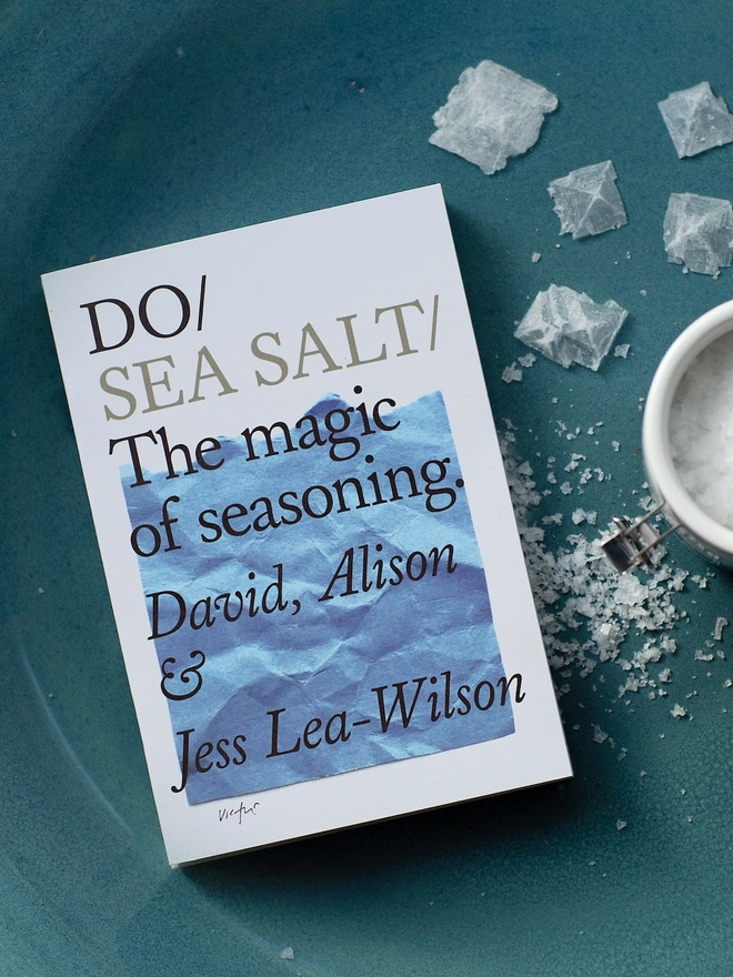 Book on table with large grains of sea salt