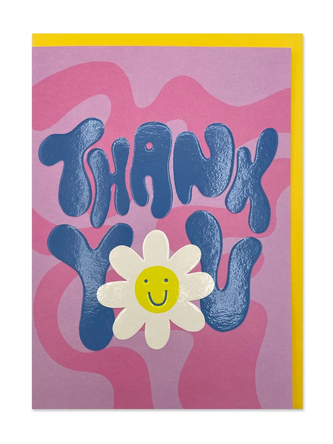 A colourful card with ’Thank You’ message in chunky 70’s inspired hand lettering in a contrasting bright blue against a psychedelic pink wave design 