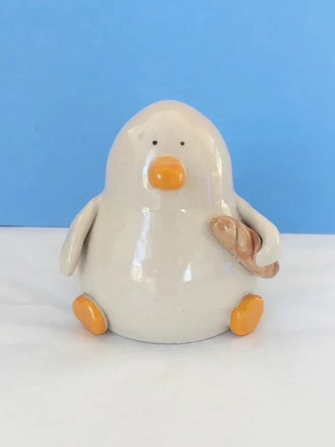Duck with a baguette sculpture