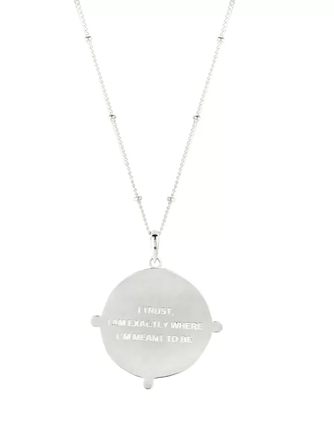 Message on reverse of silver coin pendant which reads I trust I am exactly where I'm meant to be