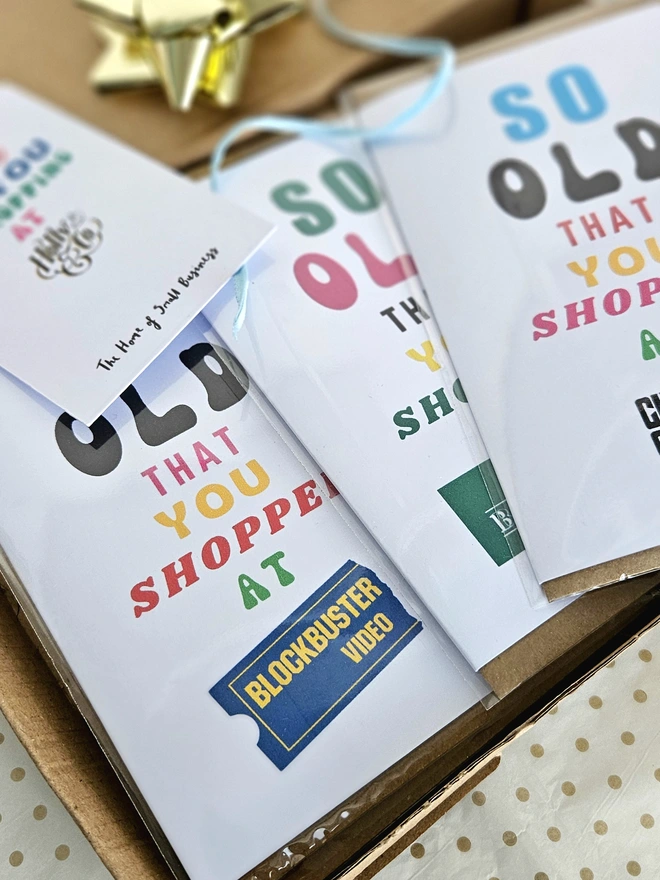 A photograph of a set of nostalgic shop cards in different designs in a box with a thank you card for shopping at Holly and Co