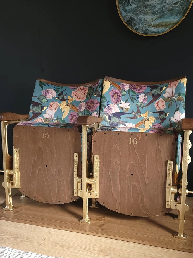Set of two vintage cinema seats with gold legs and floral velvet, seats up