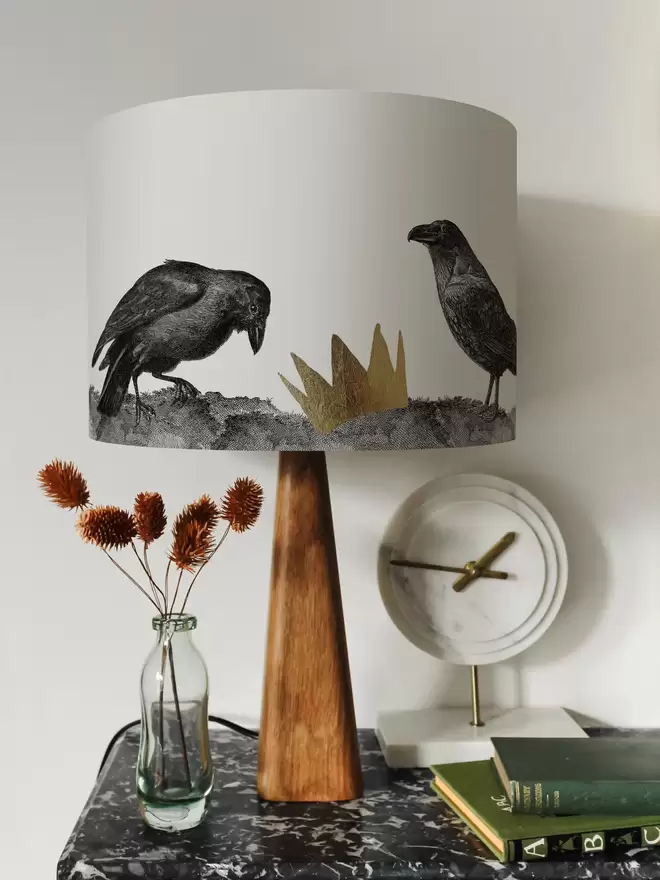 Mountain and Molehill – Ravens Lampshade on a shelf with ornaments