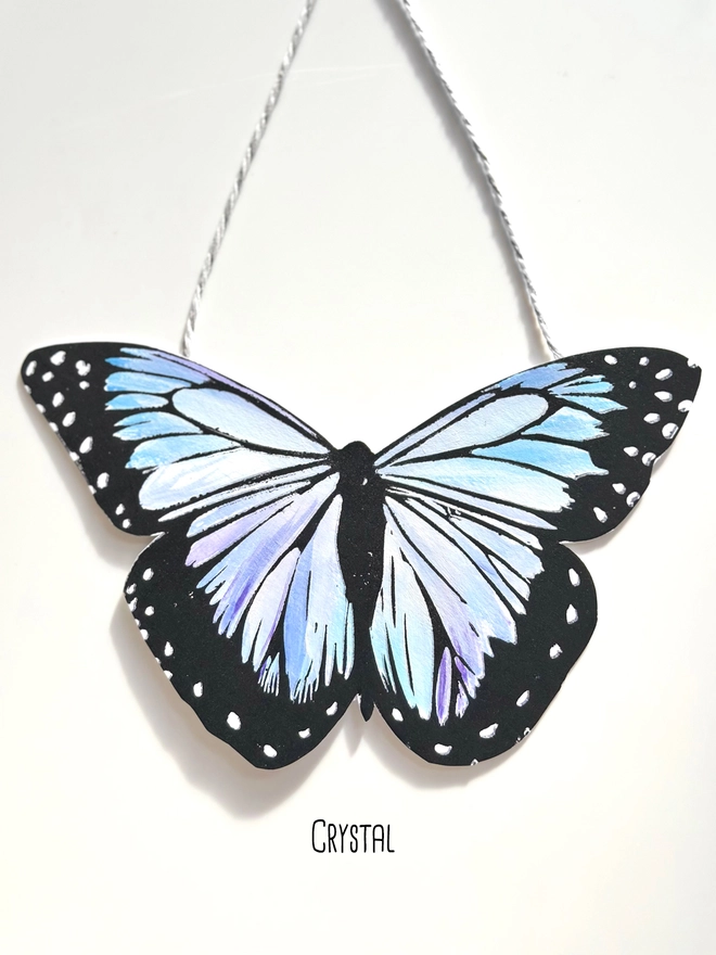 Hand Painted Butterfly Colourful Linocut Hanging Decoration In Light Blues Lilac and grey and black