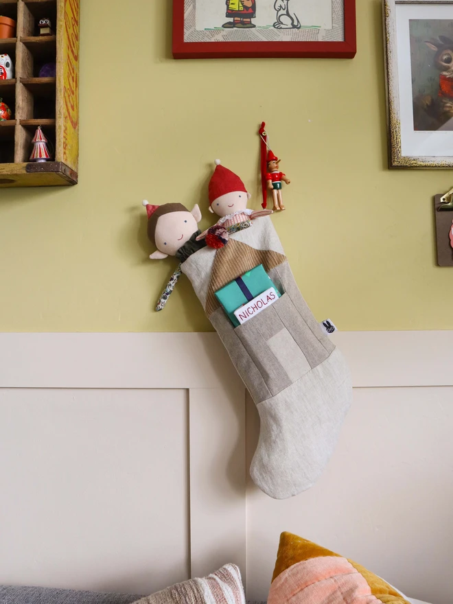 Personalised Linen Christmas Stocking with Christmas presents and elf dolls