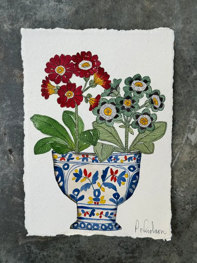 auricular flowers in a patterned ceramic vessel