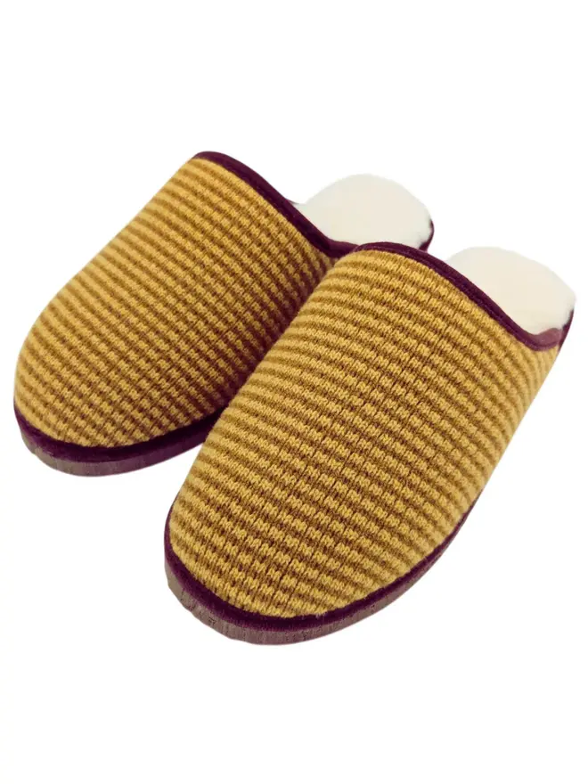 Women's Lambswool & Sheepskin Slippers, a pair of colourful slippers sitting on a white plain surface. 