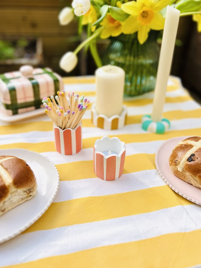 table display featuring mini scalloped pot as tea light holder