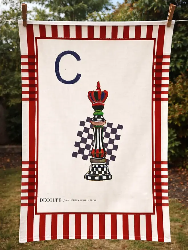 a-z alphabet tea towel. a tea towel with a chess print and the letter 'c' in the corner.