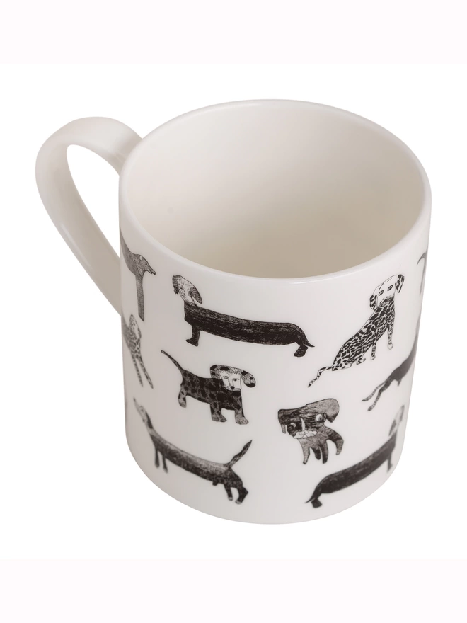 close up photo of dogalicious charity fine bone china dog gift mug featuring black dog illustrations