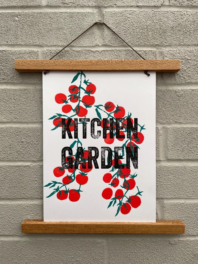 Hand-printed lino kitchen print featuring tomato illustrations on a wooden table.