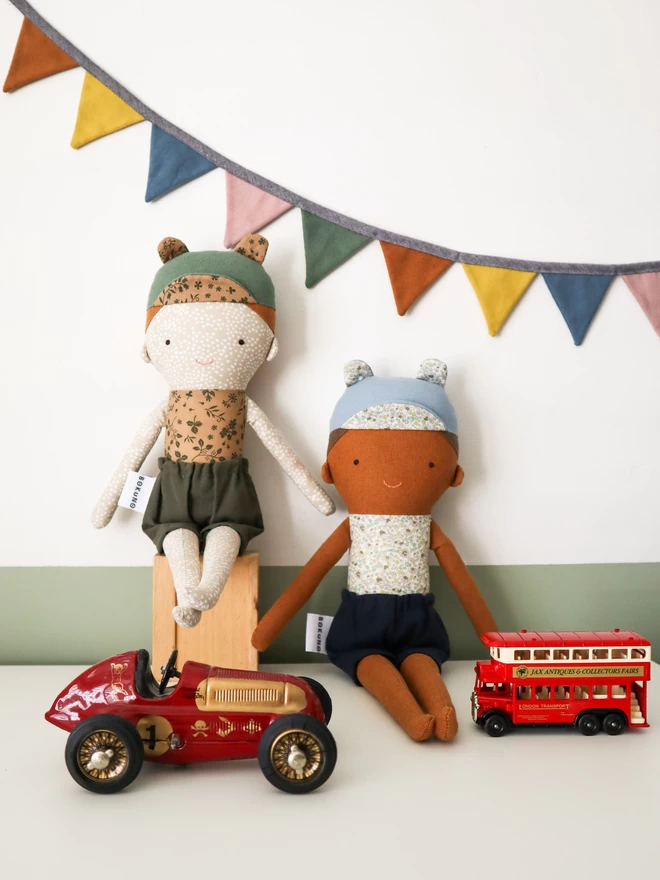 textile boy dolls with freckled face and brown skin