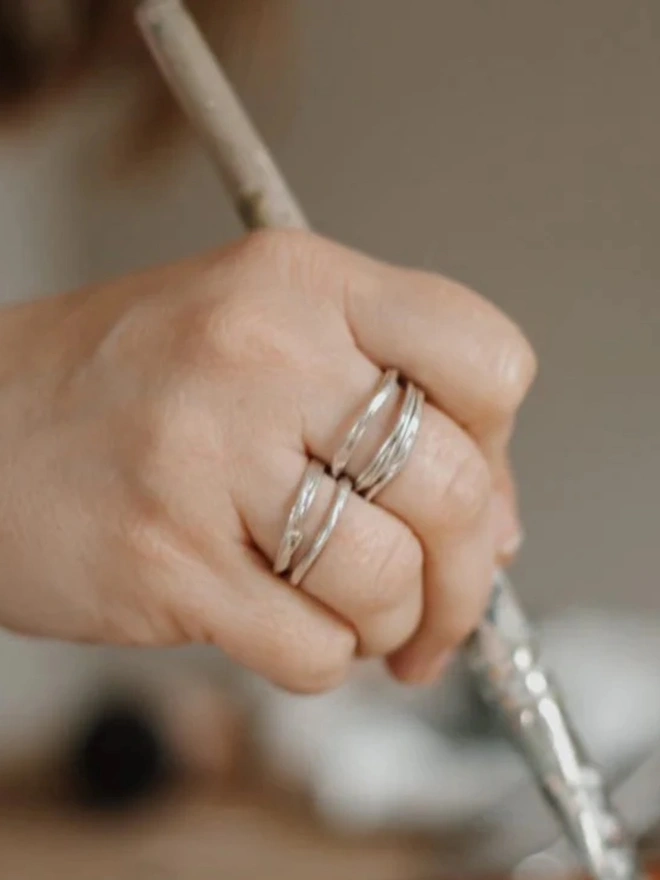 A woman wearing two Silver Organic Stacking Rings