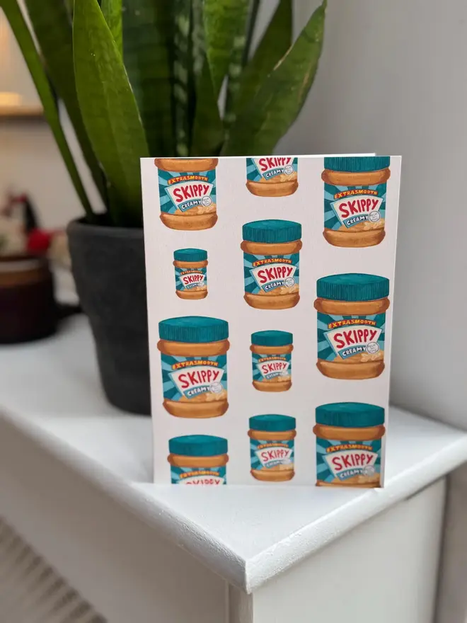 peanut butter jars illustrated card. card placed on mantelpiece.