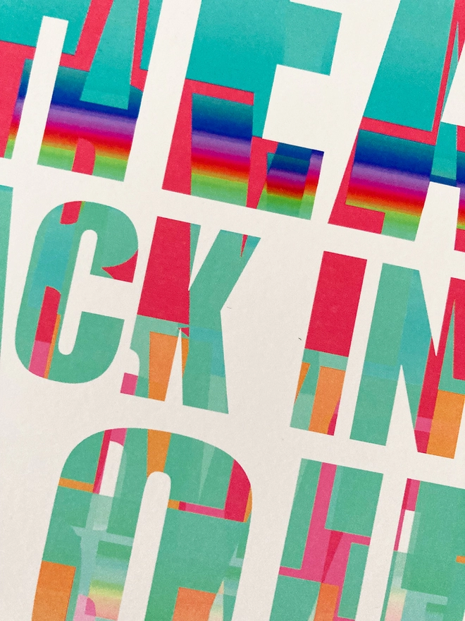 Detail from a multicoloured typographic print of a Julian Cope song, “put your head back in the clouds and shut your mouth”.
