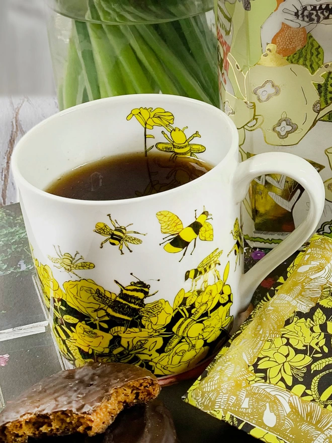 close up of bee free charity fine bone china bee gift  mug featuring yellow & black bee drawings
