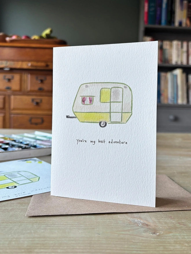 A Caravan Greeting Card which is hand painted illustration and the Card reads You're My Best Adventure 