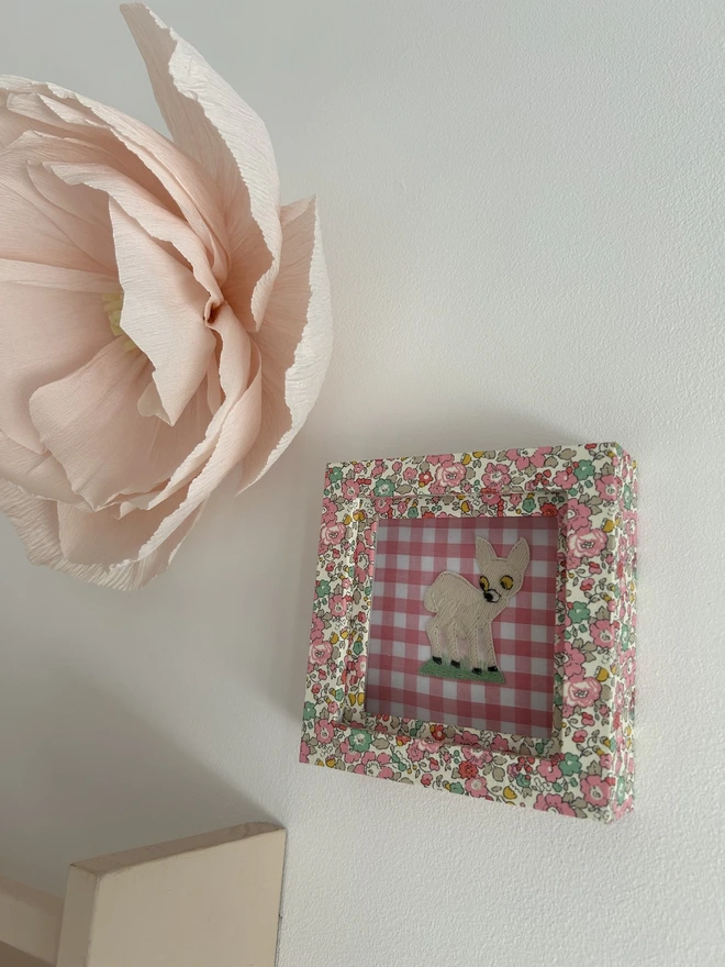 Liberty fabric mini box mount frame displayed on wall in nursery