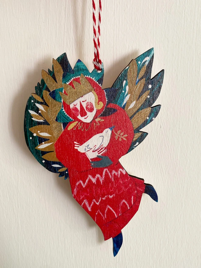 Red and green illustrated angel decoration by Esther Kent