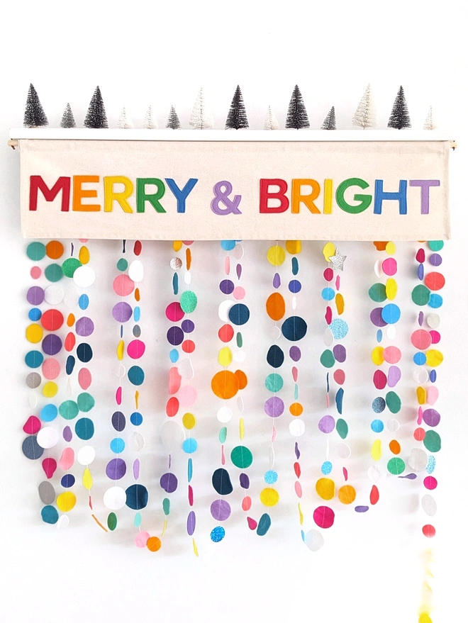 A cheerful Christmas decoration in rainbow bright colours