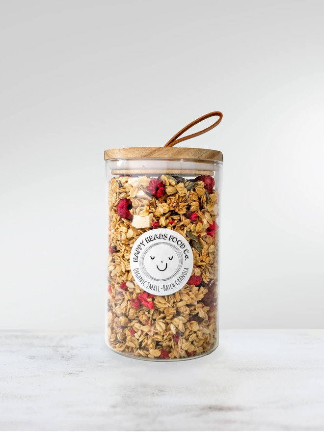 Happy Heads 'Raspberry & White Chocolate' granola in a medium (400 g) glass jar 