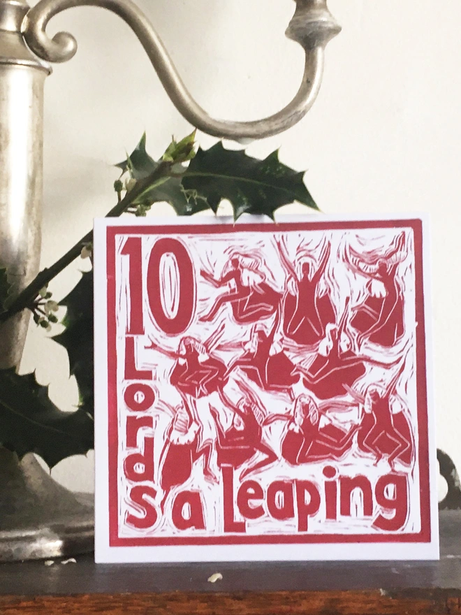Christmas card Ten Lord a Leaping The Twelve Days of Christmas linocut design by Kate Guy