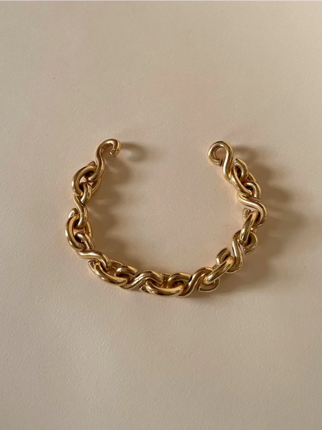 S link chunky gold bracelet with concealed fastening