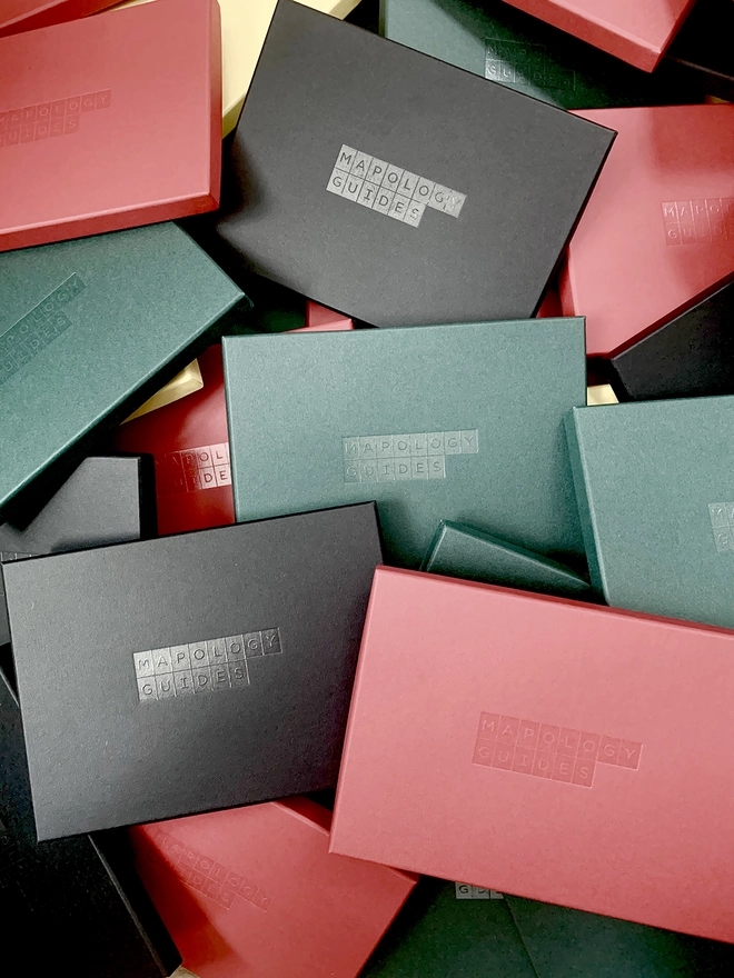 Black, red, green boxes with logo 