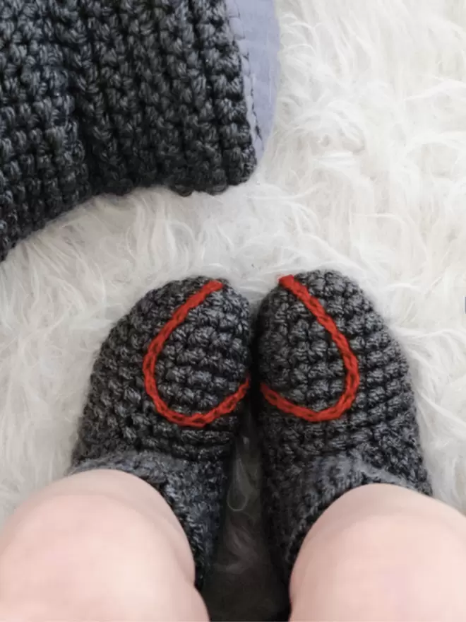 Baby booties with heart embroidery