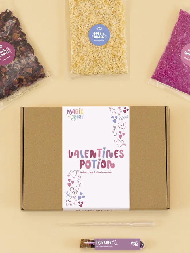 valentines mini sensory potion kit. three bags of assorted sensory materials placed around a cardboard box.