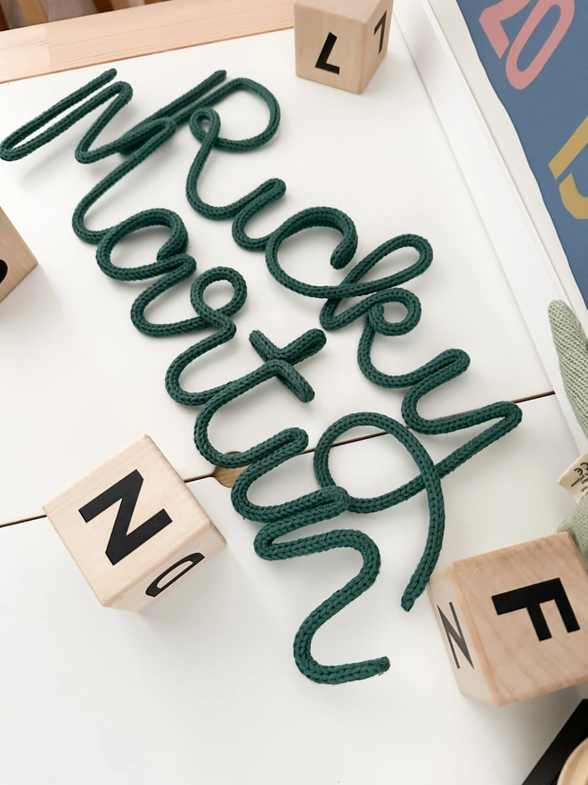 Knitted Wire Words made from 100% cotton - vegan friendly and a beautiful gift for a newborn baby and new parents or to decorate your child's bedroom, play room or nursery with a name sign to hang up on the wall. 