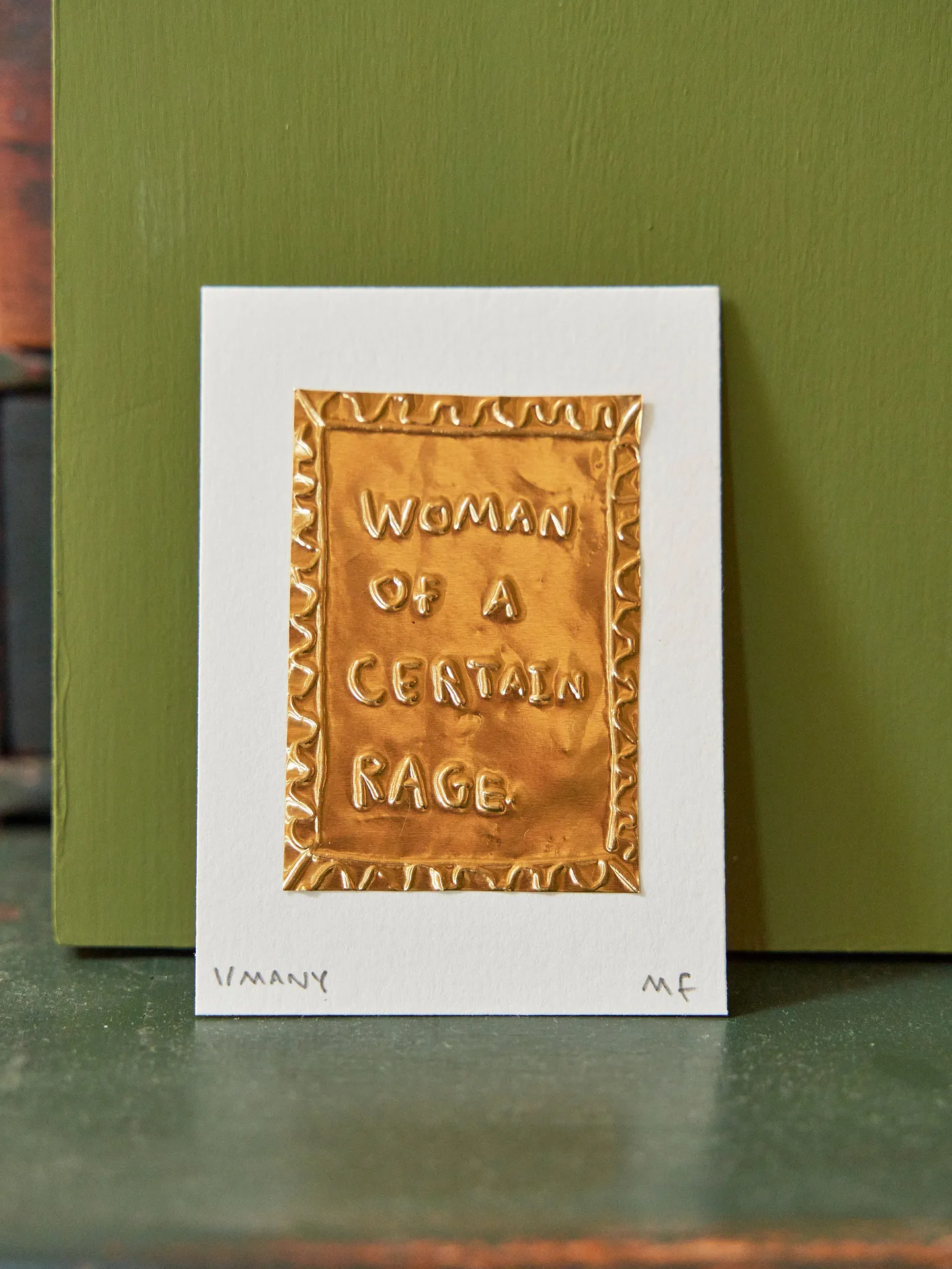 'Woman Of A Certain Rage' Gold Tin Embossing