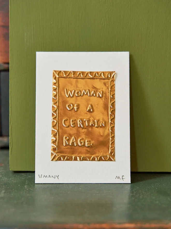 'Woman Of A Certain Rage' Gold Tin Embossing