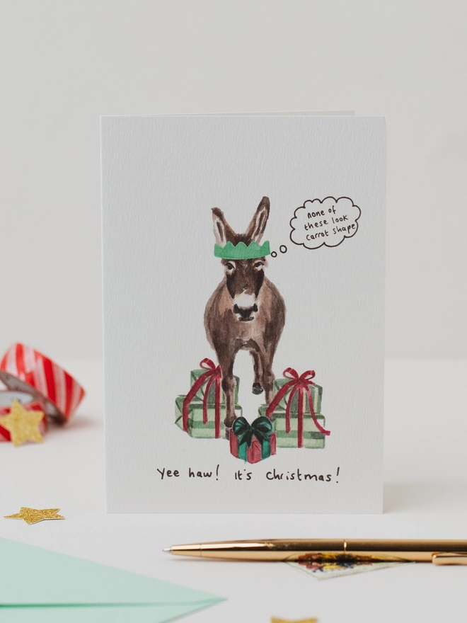 Donkey's unwanted gifts Christmas Card 