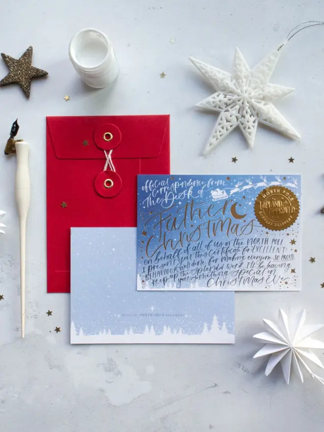A blue certificate for excellent behaviour with gold foil lettering, a sleigh silhouette and a "Lapland Approved" seal.