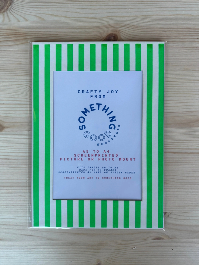 Thin Striped Screen Printed A6 / A5 / A4 Photo Mount. green striped mount pictured on a wooden table.