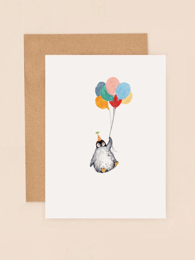 A cheerful illustration of a penguin holding a bunch of colorful balloons, exuding a sense of joy and celebration. The penguin's expressive eyes and the vibrant hues of the balloons create a playful and festive atmosphere. The design is minimalist yet heartwarming, making it a perfect choice for birthdays, congratulations, or any occasion that calls for a touch of whimsy.