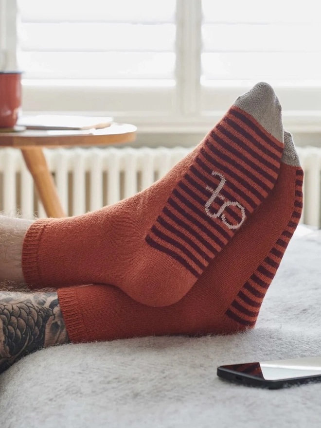 Men's Organic Cotten Striped Arch Ankle Socks, a man wearing a pair of colourful socks. 