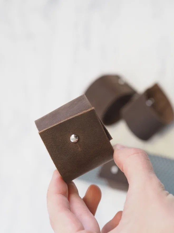 dark brown leather napkin rings