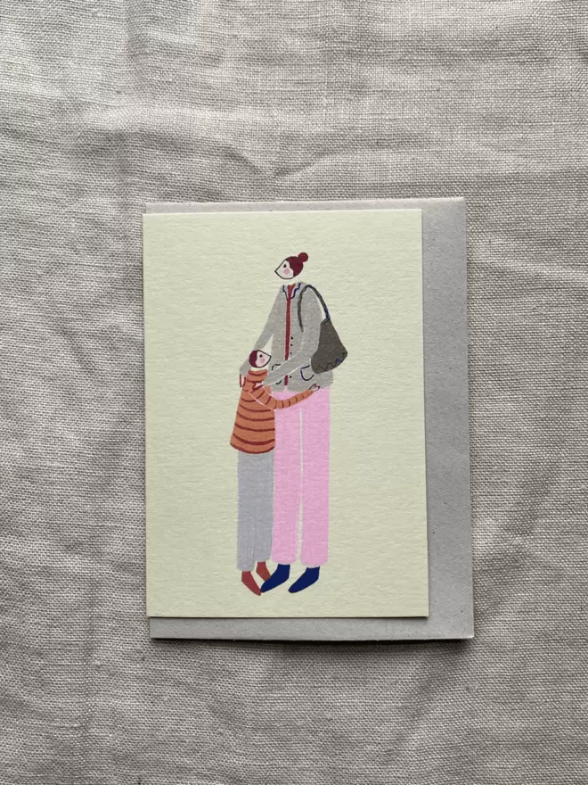 mother and child hugging on a greetings card 