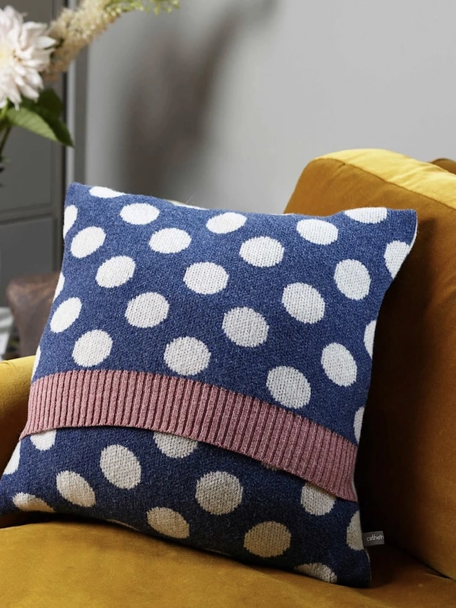 Lambswool Patterned Cushion, a cushion sitting on a yellow chair in a living room. 