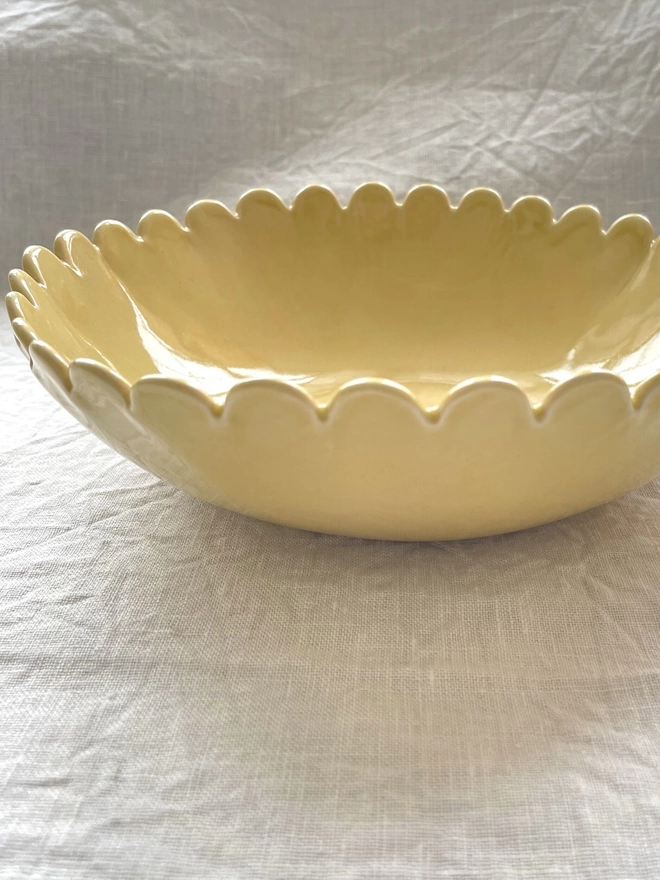 butter yellow small daisy scallop edge bowl, side view