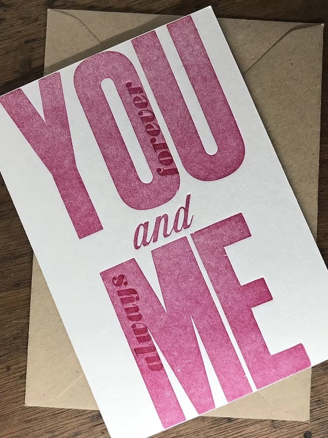 'You And Me Always And Forever' Love Card, red card placed on a brown envelope. 