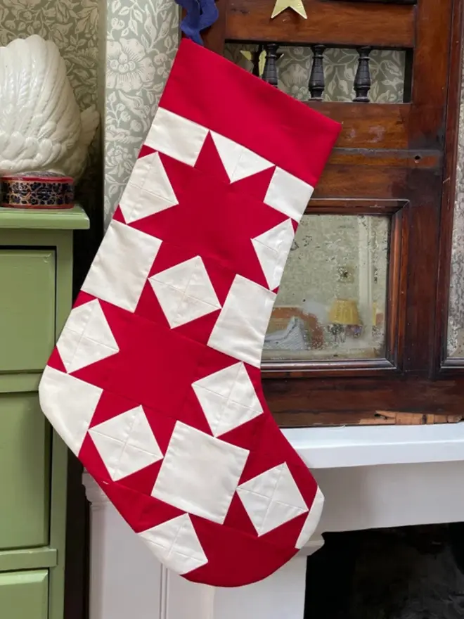 Aster Patchwork Stocking, hanging. 